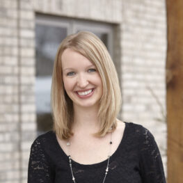 Smiling female dental staff member posing for a team profile photo