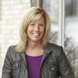 Female dental team member smiling in a professional portrait at the dental practice 3