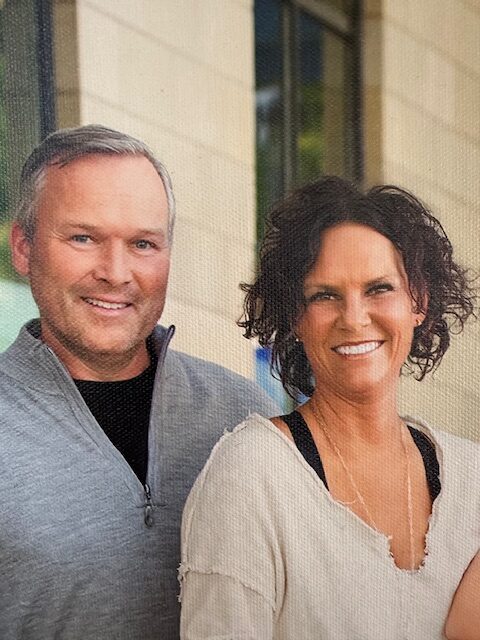 Portrait of a smiling middle-aged couple associated with Kelly Dentistry in Rochester, Minnesota